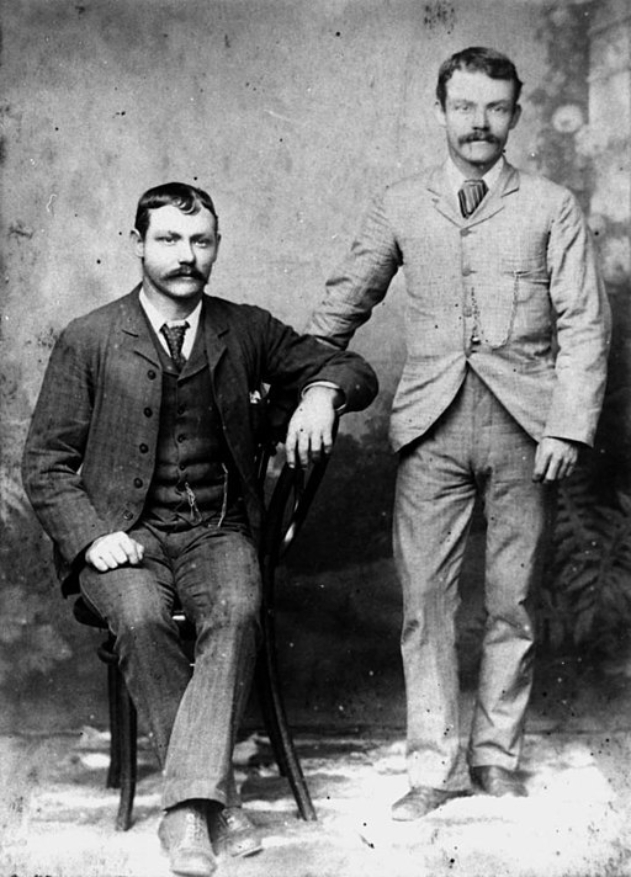 Two men posing for a portrait, 1880-1890